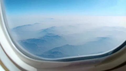 The arial view from the plane window on the mountain ridge Stock Footage 221421726