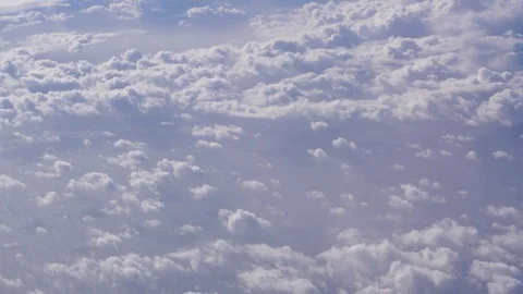 Arial view of the pretty cumulus clouds in commercial jet airplane shot in 4K Stock Footage 81684913