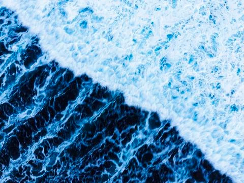 Arial view of splashing oceanic waves with bubbles and foam Stock Photos