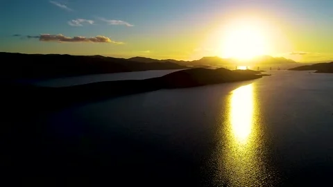 Arial view of sunset over the sea	 Stock Footage 141125532