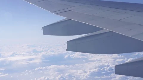 Arial view of the wing and pretty clouds in commercial jet airplane shot in 4K Stock Footage 81684902
