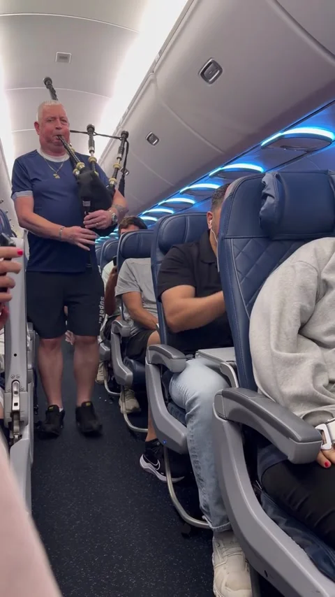Ariana, what are you doing here, On a delta flight from Boston to Nashville - 22 Video stock 337644102