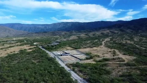 Arid Mountain Valley with Sparse Vegetation Stock Footage 306893316