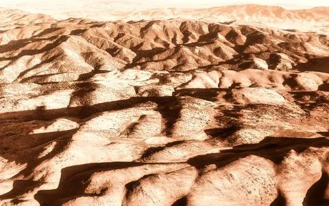 Arid Mountainous Landscape with Dramatic Shadows from Aerial View Stock Photos