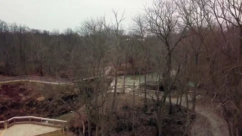 Ariel Drone Crane Shot Of Forest Over Waterfall With Bridge Stock Footage 171306752