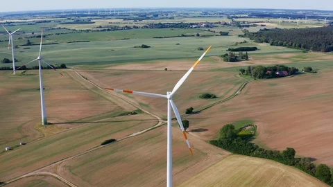 Ariel fly around a windmill and green fields in Germany Stock Footage 116629357
