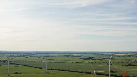 Ariel fly around a windmill and green fields in Germany 스톡 동영상 116629532