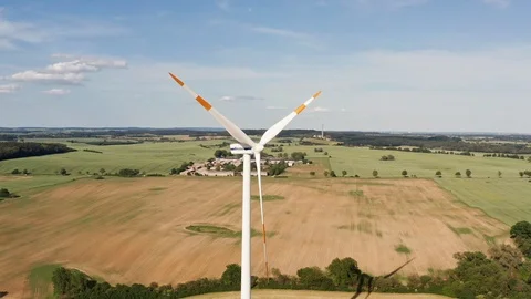 Ariel fly around a windmill and green fields in Germany Stock Footage 116630161