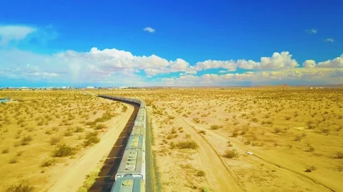 Ariel shot of Train in the middle of the desert. 스톡 동영상 86587326