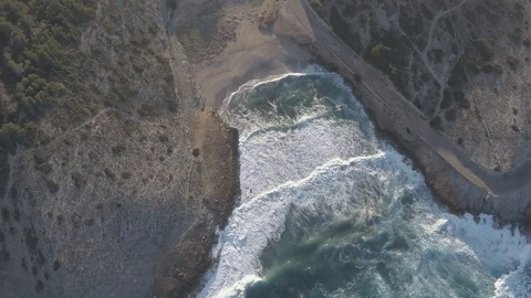 Ariel View Above 3 meter waves and deserted beach during sunset Stock Footage 101426540