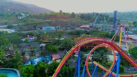 Ariel View of colourful roller coaster with Park rides Stock Footage 91742101