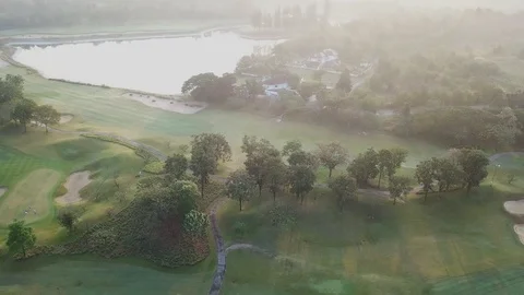 Ariel view of golf course in the morning Stock Footage 125289670