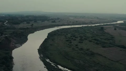 Ariel view of river flowing through the forest Stock Footage 132826941