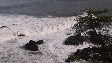 Ariel View of Waves Breaking on Sea Stacks. Jaco, Costa Rica Stock Footage 243387498