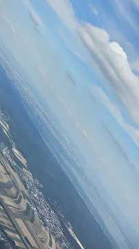An ariel view while flying in an airplane Фото