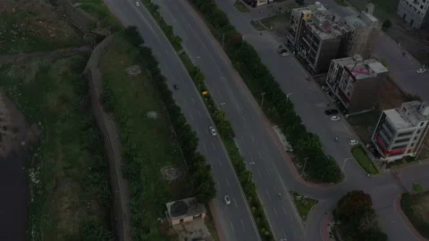 Ariel view of white car going on a road Stock Footage 133003604
