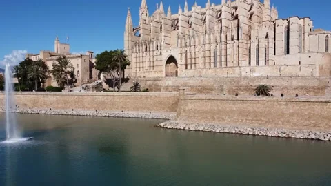 Arising diagonal view of La Seu Gothic Cathedral - 4 K video in sunny day Stock Footage 166575115