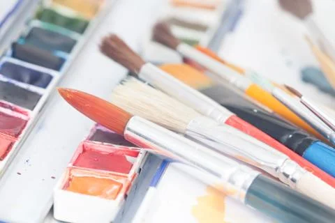 Aristic paint and brushes Stock Photos