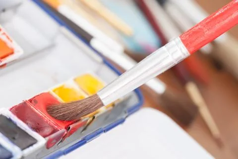Aristic paint and brushes Stock Photos