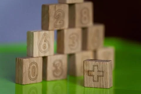 Arithmetic, mathematic, learning concept, numbers background with wooden cube Stock Photos