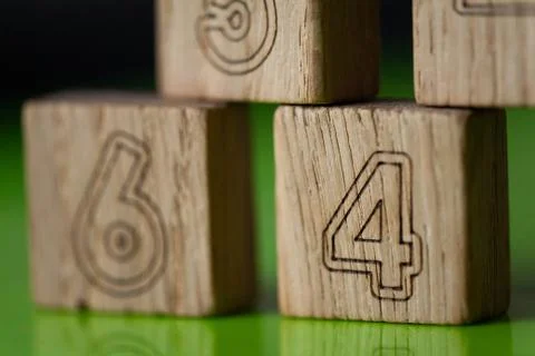 Arithmetic, mathematic, learning concept, numbers background with wooden cube Stock Photos