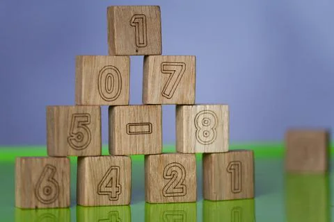 Arithmetic, mathematic, learning concept, numbers background with wooden cube Stock Photos
