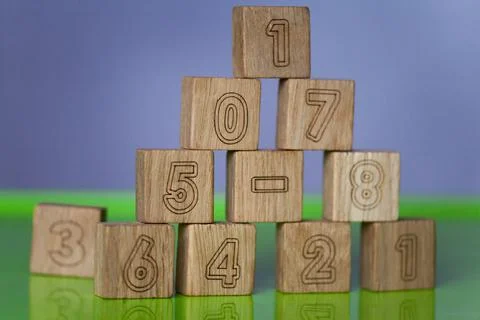 Arithmetic, mathematic, learning concept, numbers background with wooden cube Stock Photos