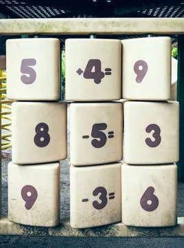 Arithmetical problem Math games on rotary white plates Copyright: xZoonar.... Stock Photos
