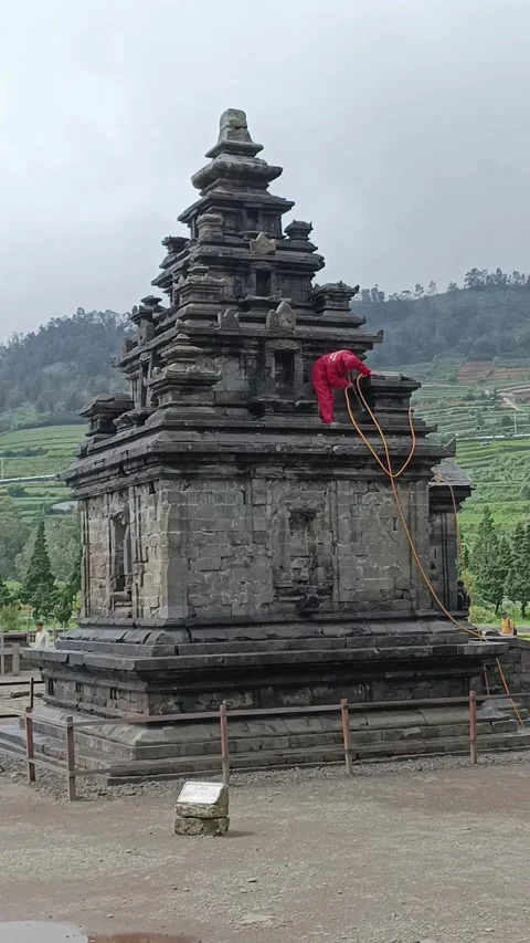 Arjuna Temple complex cleaning process in Dieng, Central Java Stock Footage 304113690