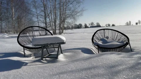 Arm chairs covered with deep snow in 4K Stock Footage 233835350