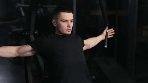 Arm exercises, Workout machine, Bicep curls Stock Footage 239030931