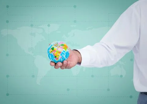Arm with globe against green map Foto stock
