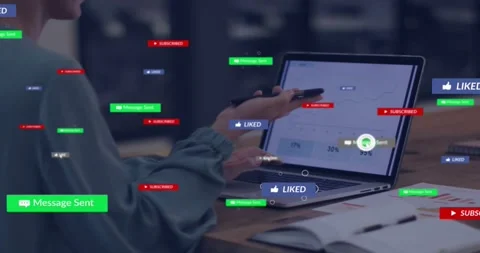 Arm reaching for phone, user speaking into phone while tapping laptop to send 스톡 동영상 332281831