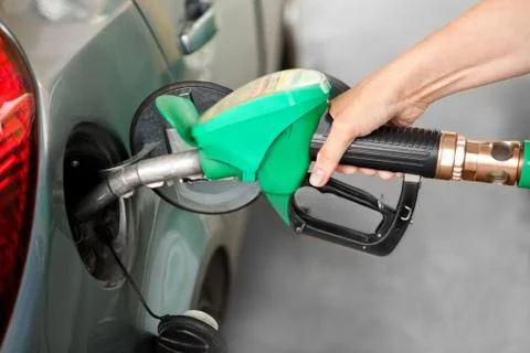 A Arm Refueling the Car at a Gas Station Stock Photos