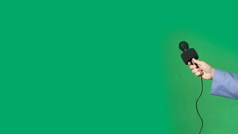 Arm of Reporter with Microphone on  Green Screen Stock Footage 109382001
