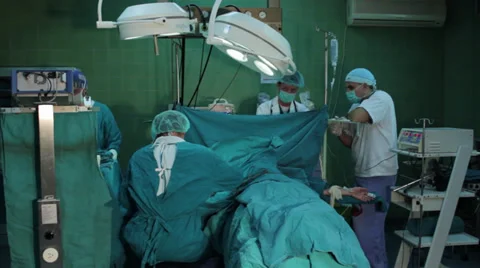 Arm surgery. Surgeons team performing operation hand in hospital operating room. Stock Footage 34922600