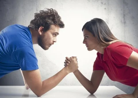Arm wrestling between a couple Stock Photos