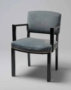 Armchair with angular armrests and covered with blue tripe. Armchair of bl... Fotos de archivo