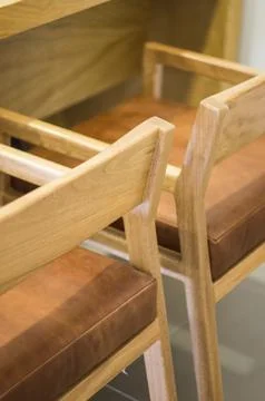 Armchair, chair, individual sofa, solid natural wood structure, seat and back in Stock Photos