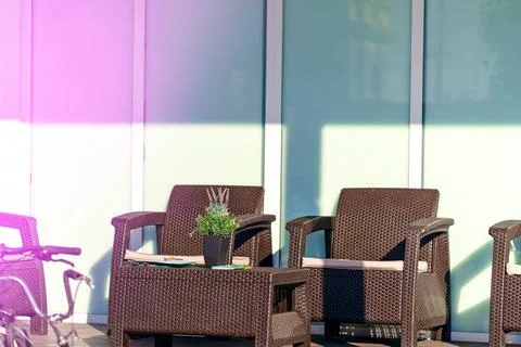 Armchairs and a coffee table with documents on tablets on the street Stock Photos
