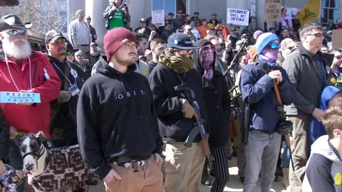 Armed activists chant "Pro-2A" and "Come and take it!" Stock Footage 126439654