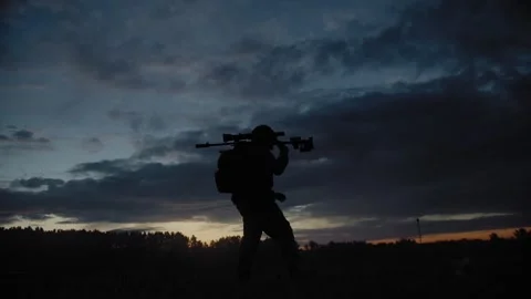 An armed and equipped special forces (SWAT) soldier with a sniper rifle Stock Footage 327458865