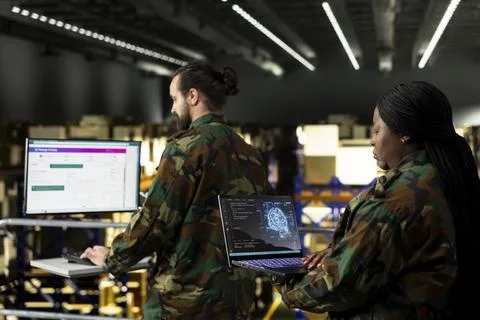 Armed forces staff leveraging artificial intelligence and cloud computing tools Stock Photos