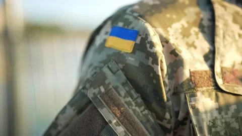 Armed forces of Ukraine yellow-blue flag on a soldier's shoulder. Stock Footage 257947804