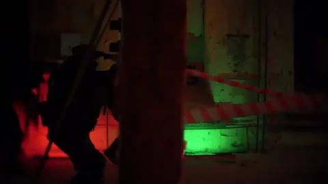 Armed Paramilitary Men or a Police Squad Attacks a Terrorist Base. Armed SWAT Stock Footage 198809478