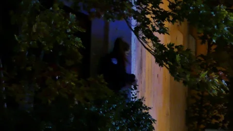 Armed police hiding behing wall Stock Footage 120000485