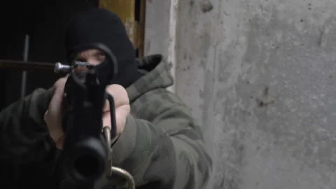 Armed Resistance Fighter Aims at Camera Video stock 171052626