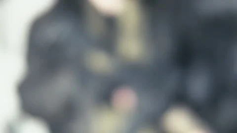 Armed security contractor walks into focus holding an AR15 Stock Footage 133546581