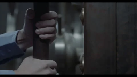 Armed Security Guard hands slowly opens Heavy Door, Bank Vault. Machine Gun Stock Footage 204933350