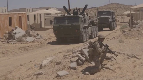 Armed soldier aiming weapon during realistic live fire exercise Stockbeeldmateriaal 114001813